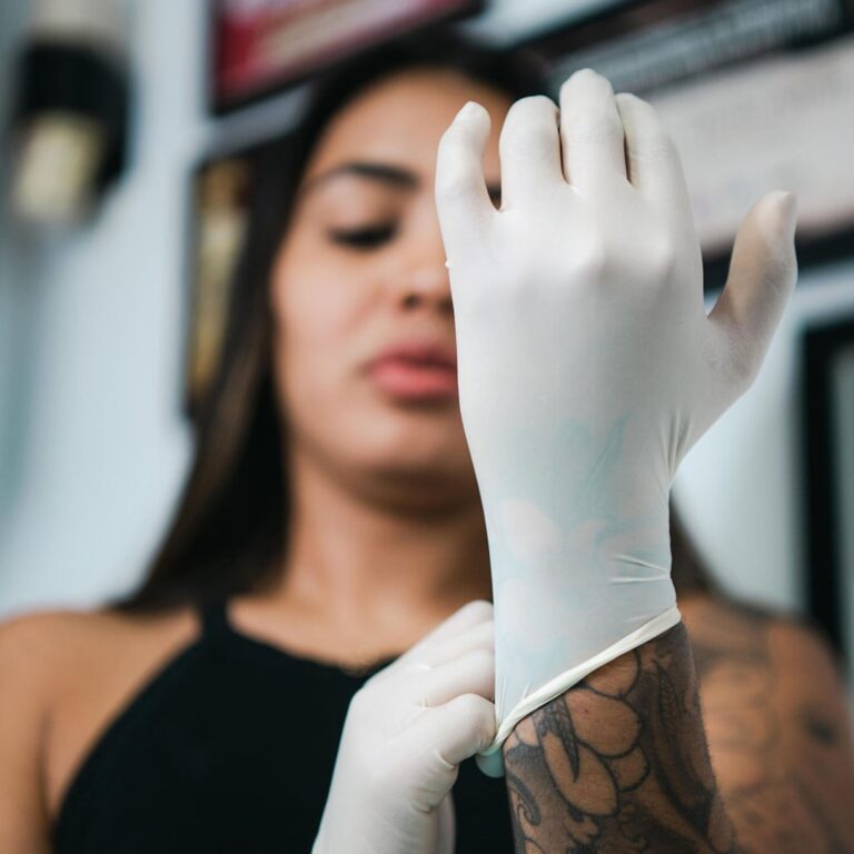 tattoo shop artists putting on latex gloves